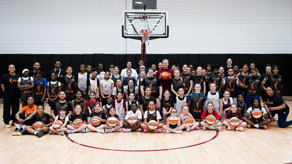 Cavaliers Legend Mark Price shown at Rocket Arena with 60 girls, aged 8-14, who participated in the 28th female-focused event since September 2025.